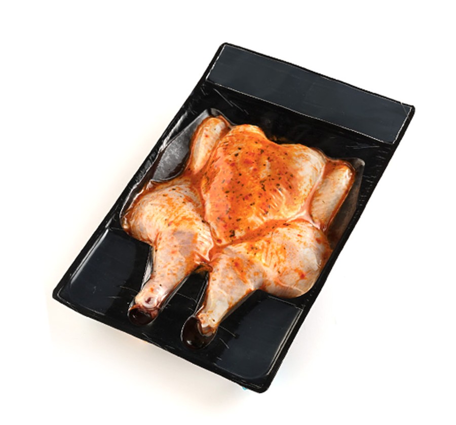 Vacuum-sealed marinated flattened chicken